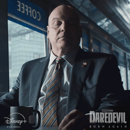 Man in Suit and Tie with Coffee