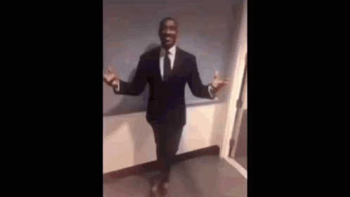 Man in Suit and Tie With Crossed Legs