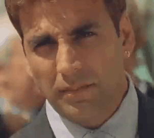 Man In Suit And Tie With Earrings GIF
