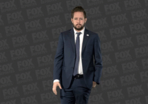 Man in Suit and Tie with Fox Ad