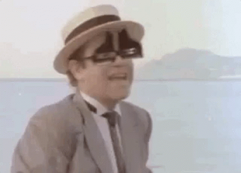 Man In Suit And Tie With Hat And Glasses GIF