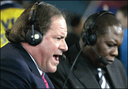 Man in Suit and Tie With Headphones and Microphone