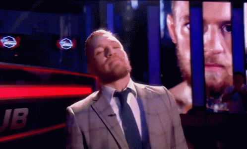 Man in Suit and Tie With jb Screen
