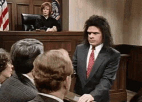 Man In Suit And Tie With Judge GIF