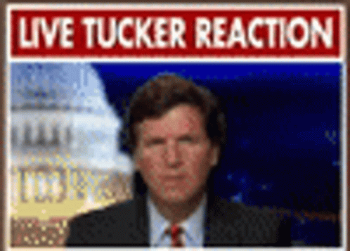 Man in Suit and Tie With Live Tucker Reaction Sign
