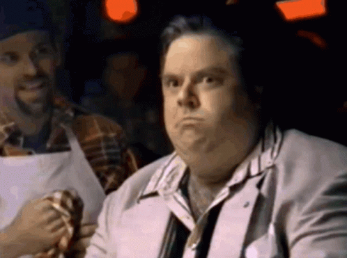Man In Suit And Tie With Man In Apron GIF
