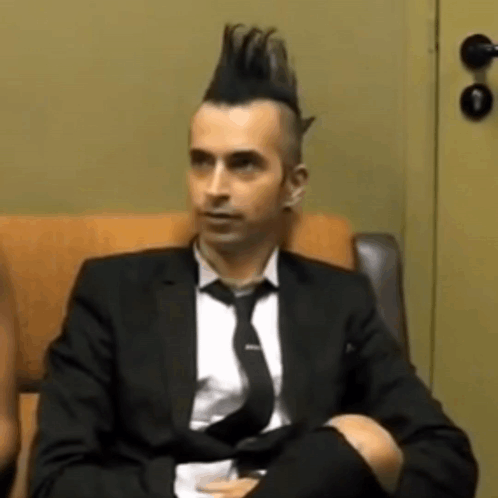 Man in Suit and Tie with Mohawk