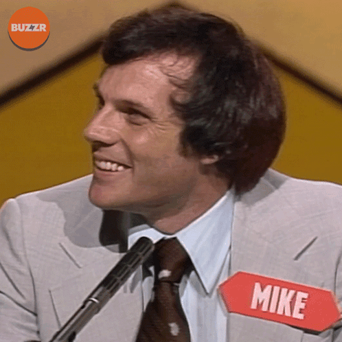 Man in Suit and Tie with Name Tag Mike