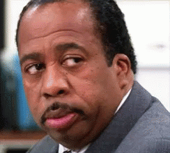 Man In Suit And Tie With NBC Logo GIF