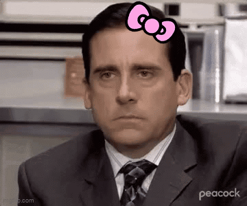 Man in Suit and Tie With Pink Bow on Head