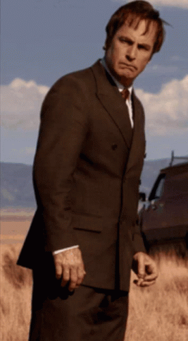 Man in Suit and Tie With Ribbon