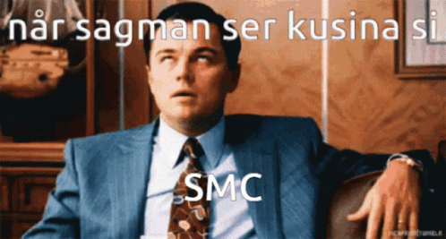 Man in Suit and Tie with SMC on Face