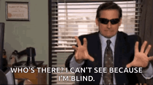 Man in Suit and Tie With Sunglasses Talking