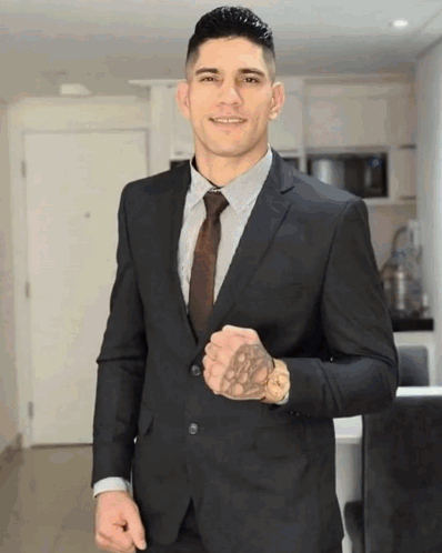 Man in Suit and Tie With Tattoo