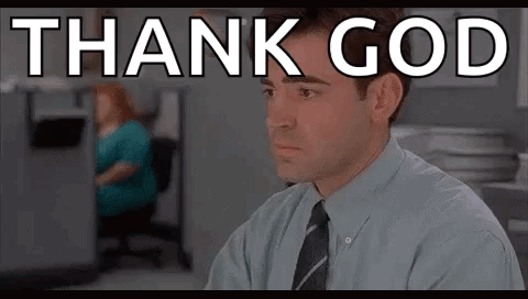 Man in Suit and Tie with Thank God on Screen