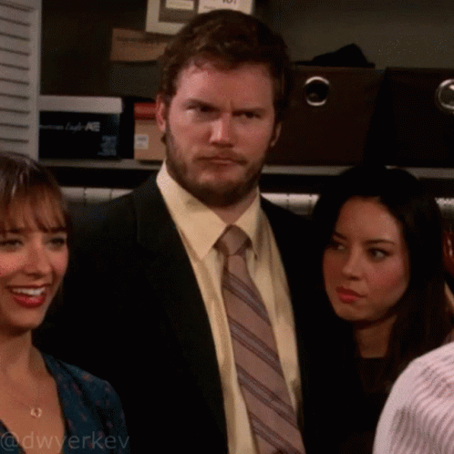 Man in Suit and Tie with Two Women