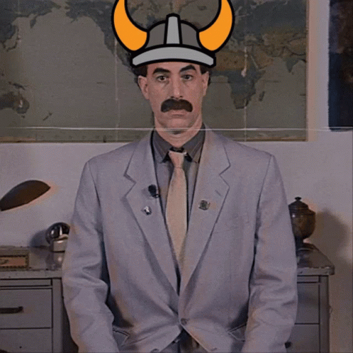 Man In Suit And Tie With Viking Hat GIF