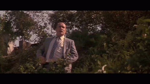 Man in Suit and Tie With Word Defense