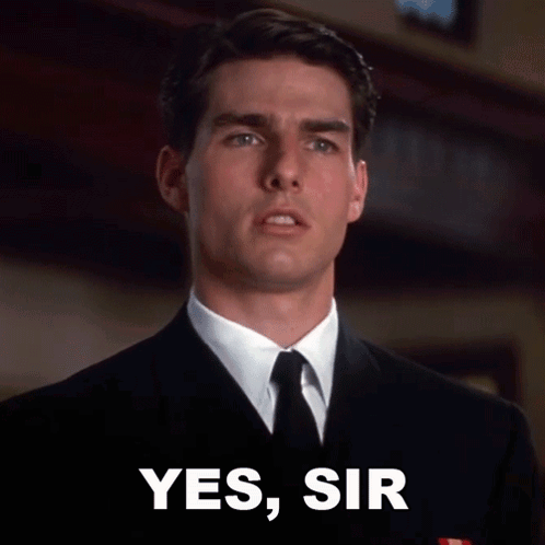 Man in Suit and Tie With Yes Sir Sign