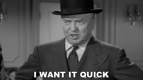 Man in Suit and Top Hat Saying I Want It Quick