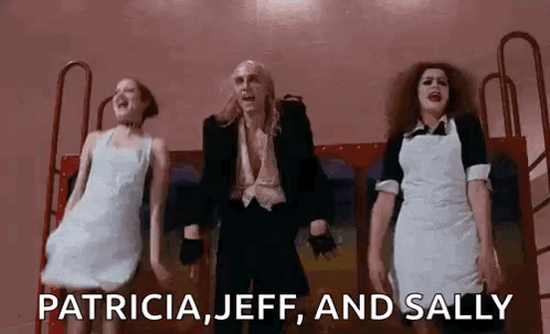 Man In Suit And Two Women Dancing GIF