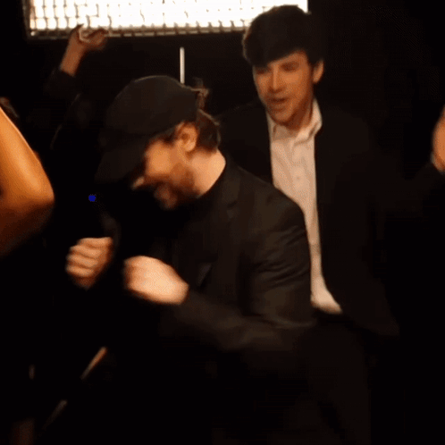 Man in Suit and White Shirt Dancing