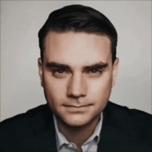 Man In Suit And White Shirt Looks Serious GIF