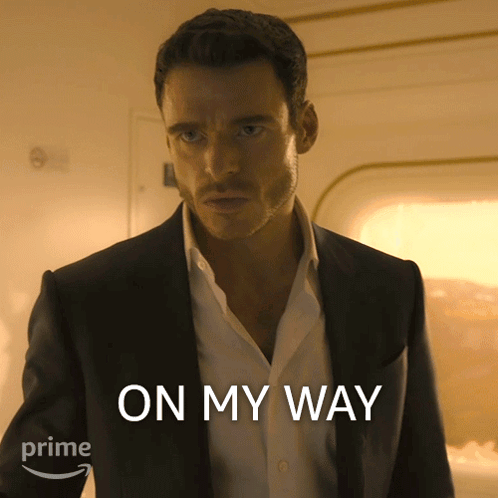 Man In Suit And White Shirt Saying On My Way GIF