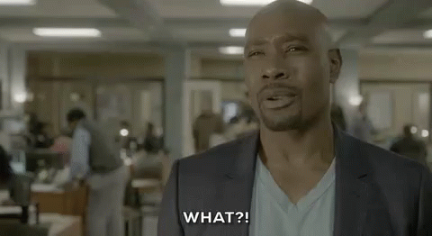 Man in Suit and White Shirt Talking