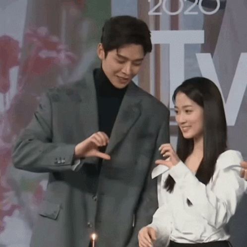 Man In Suit And Woman In White Shirt With 2020 GIF