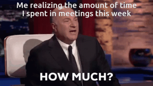 Man in Suit Asking How Much Time Spent in Meetings