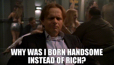 Man in Suit Asking Why I Was Born Handsome