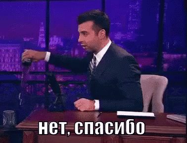 Man in Suit at Desk With Foreign Language