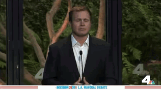 Man in Suit at Mayoral Debate