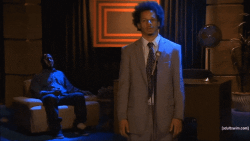 Man In Suit At Microphone Adult Swim.com GIF