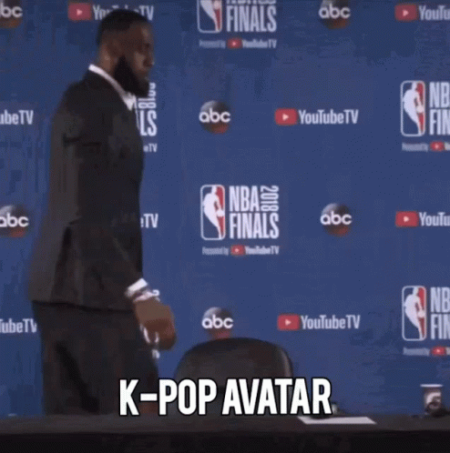 Man in Suit at NBA Finals Sign