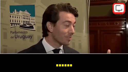 Man In Suit At Parliamento Del Uruguay Sign GIF