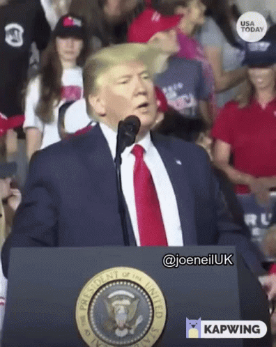 Man in Suit at Podium With Presidential Seal