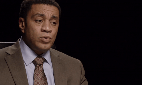 Man In Suit At The Situation Is Uncertain Sign GIF