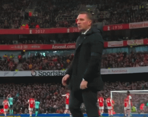 Man In Suit Before Arsenal.com Ad GIF