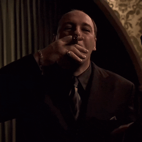 Man In Suit Blowing Kiss GIF
