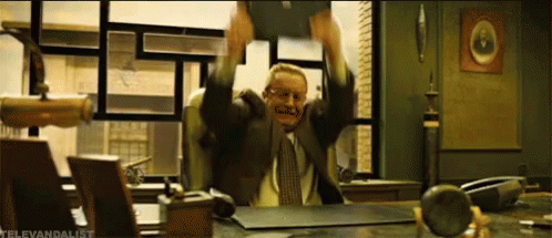 Man In Suit Breaking His Laptop GIF