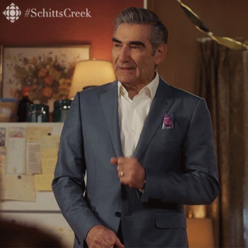 Man in Suit by Refrigerator with Schitts Creek