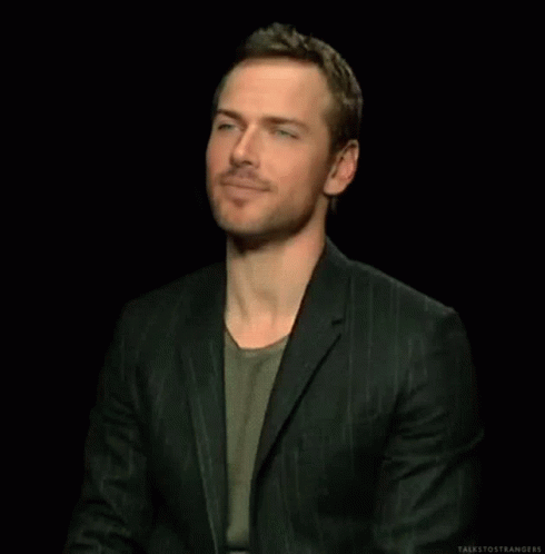 Man in Suit Clapping Hands