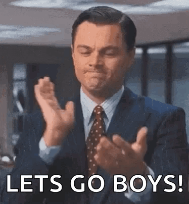 Man in Suit Clapping Saying Lets Go Boys
