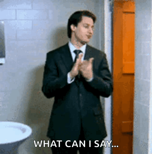 Man in Suit Clapping Saying What