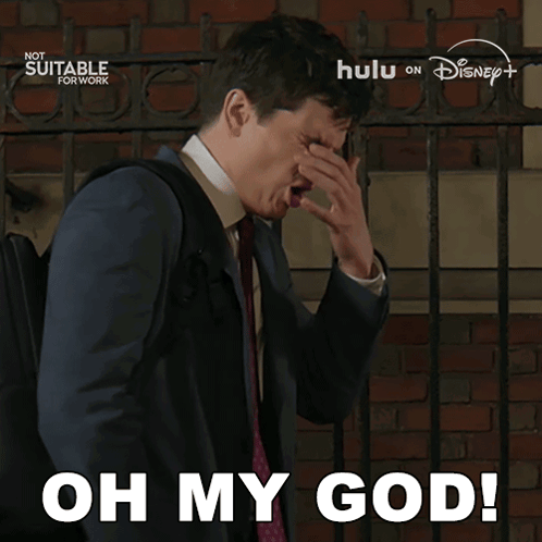 Man In Suit Covering Face Saying Oh My God GIF