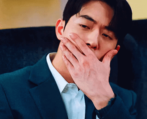 Man In Suit Covering Mouth GIF