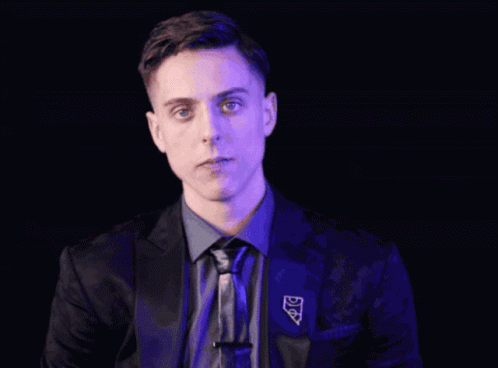 Man in Suit Covering Mouth