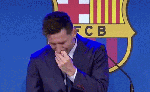 Man in Suit Crying at Microphone FCB Logo